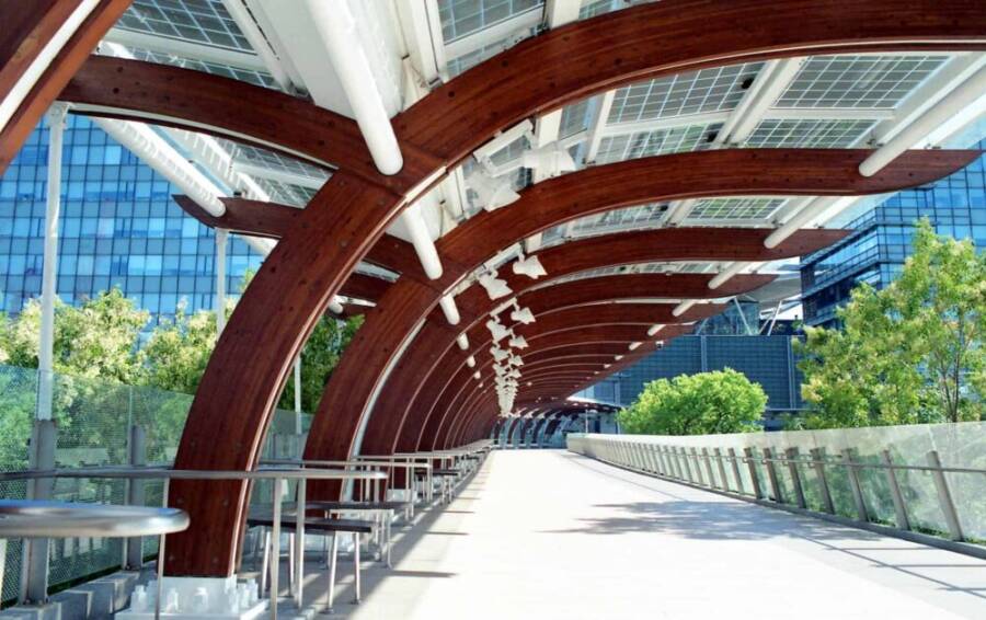 Urban footbridge with solar panels and wooden arches in Taipei, Taiwan.