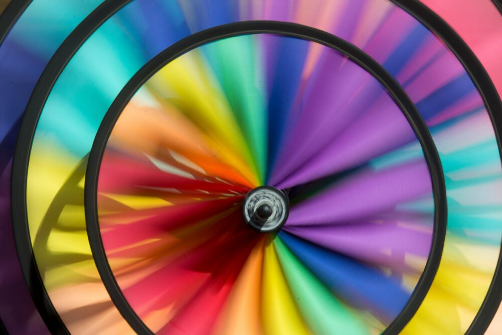 Dynamic close-up of a colorful spinning wheel displaying a vivid rainbow spectrum.