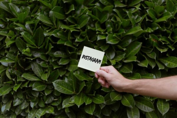 A hand holding a note with