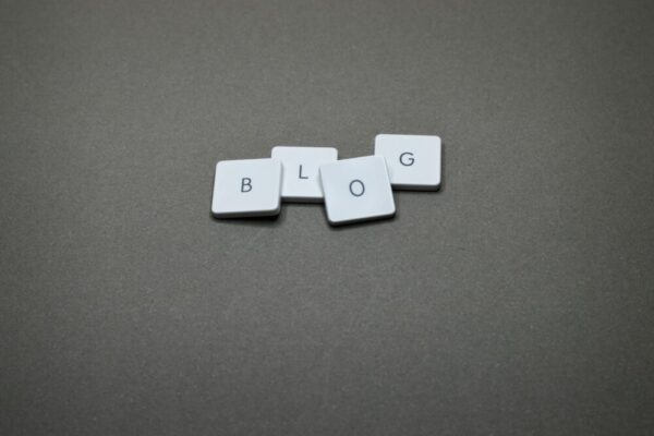 White Scrabble tiles spelling