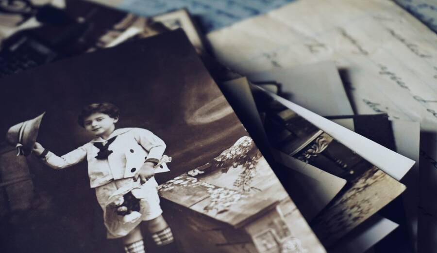 A nostalgic close-up of vintage photos and letters revealing memories from the past.