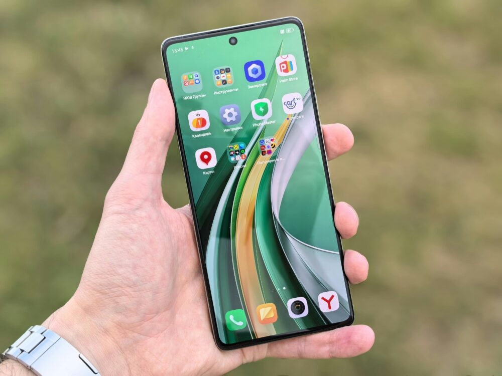 Close-up of a smartphone displaying colorful app icons against a blurred background