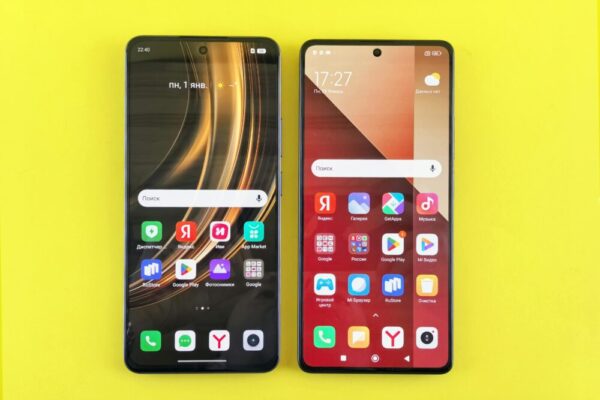 Reno11 對比 Galaxy A55:顯示、效能與價格誰更值得買?(Reno11 与 Galaxy A55:显示/性能/价格对比) Two modern smartphones displayed side by side on a bright yellow surface. Minimalist technology concept.