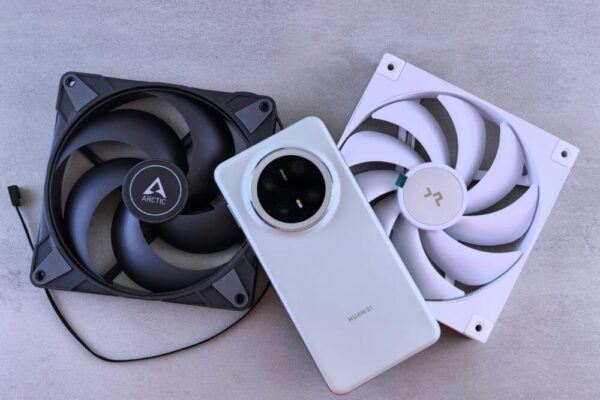 Image of a smartphone with cooling pads and devices on a textured surface