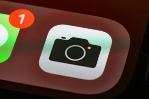 Detailed view of a smartphone camera app icon with notification badge