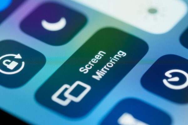 Detailed close-up of a smartphone screen highlighting the screen mirroring feature and controls.