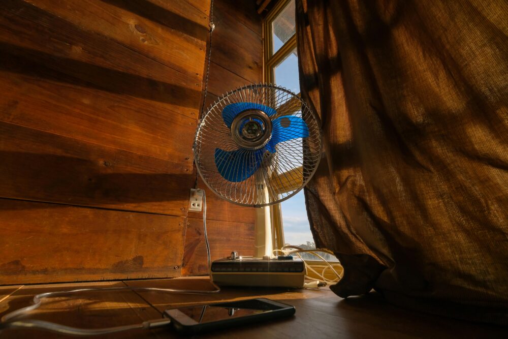 A Nostalgic Scene with a Fan and a Phone