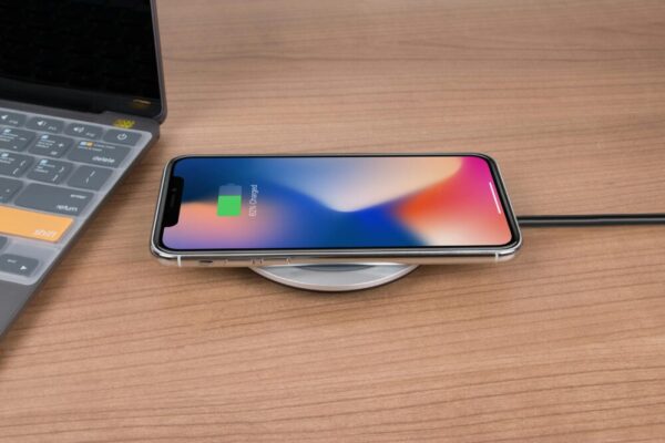 Mobile phone charging on desk