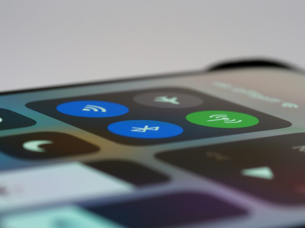 Detailed view of a smartphone control center showing wireless icons, perfect for tech-related topics.