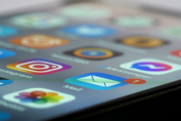 Detailed close-up of smartphone screen displaying various app icons and notifications
