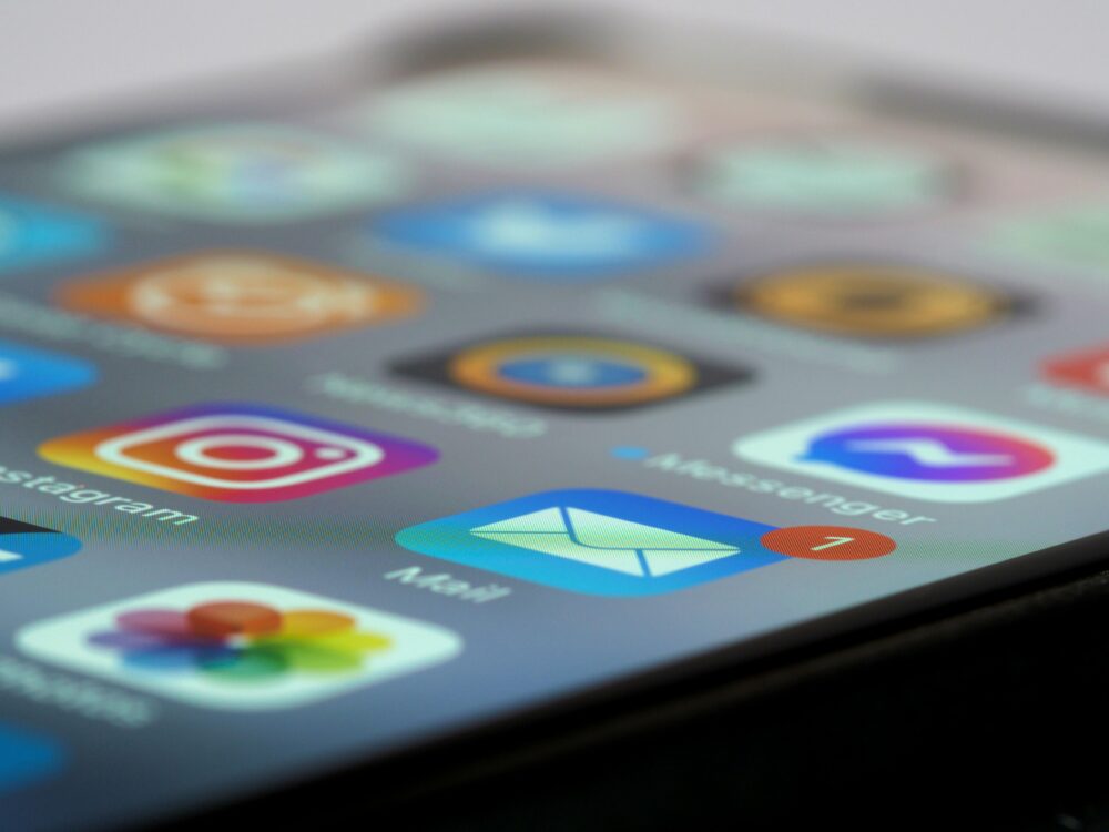 Detailed close-up of smartphone screen displaying various app icons and notifications