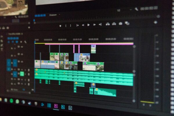 Close-up of a video editing timeline interface on a computer screen, showcasing professional software in action.