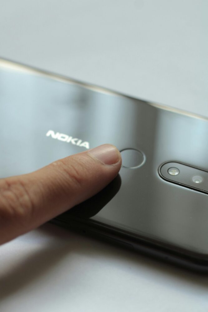 Close-up of a finger touching a smartphone