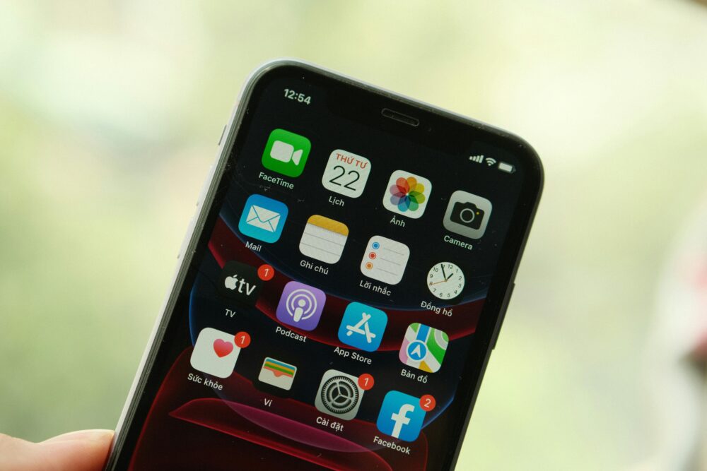 Close-up view of a smartphone screen displaying various apps and notifications.
