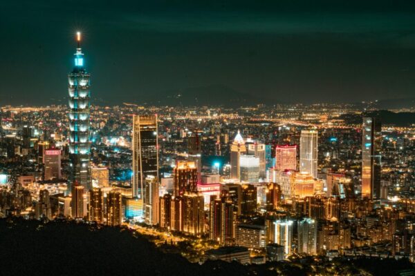 Glowing Taipei cityscape featuring the iconic Taipei 101 at night