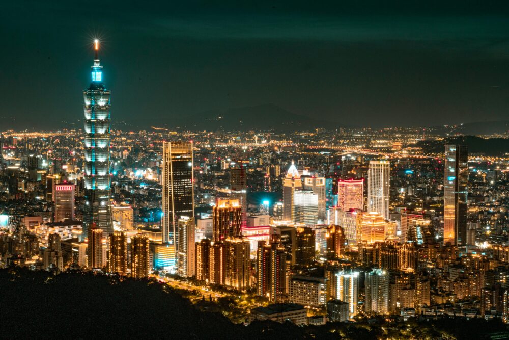 Glowing Taipei cityscape featuring the iconic Taipei 101 at night