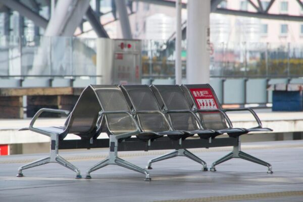 Empty modern bench seating at train station platform in Taichung, Taiwan.