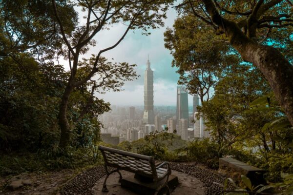 A picturesque view of Taipei park bench amid greenery