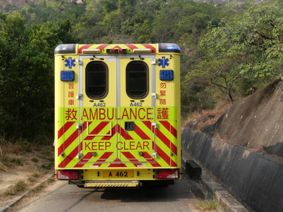 Ambulance and responders preparing to assist a patient