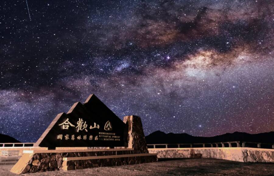 A captivating view of the Milky Way over Hehuanshan monument and national forest recreation area at night.