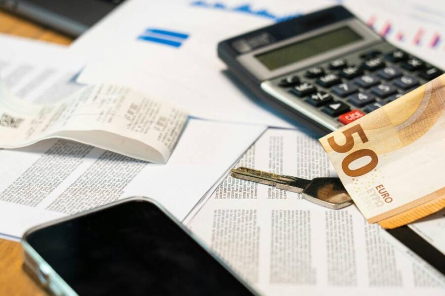 Budget planning with a smartphone on a desk