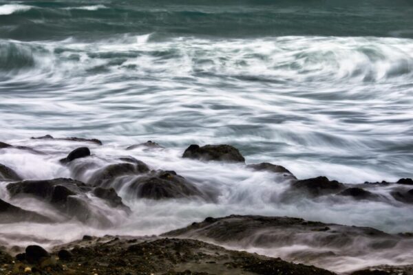 Captivating long exposure of waves crashing over rocks at the coast of Hualien, Taiwan.