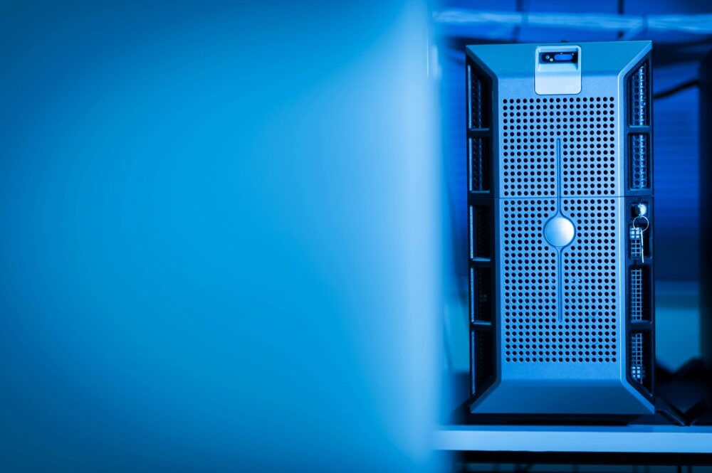 Close-up of a modern server unit in a blue-lit data center environment
