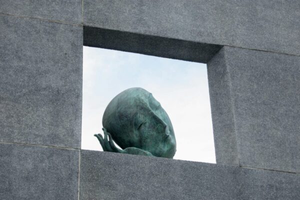 Modern sculpture framed by stone walls in Taichung, Taiwan.