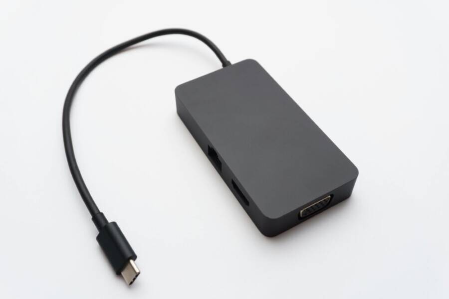 Sleek USB-C hub with HDMI, USB, and Ethernet ports on white background