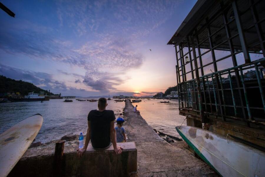 A tranquil harbor at sunset in Hong Kong