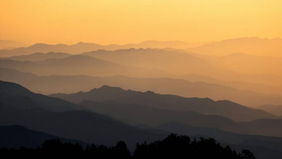 Captivating view of misty mountain layers at sunrise in Taiwan