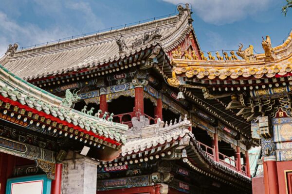 Intricate eaves and vibrant colors of a traditional temple in Beijing