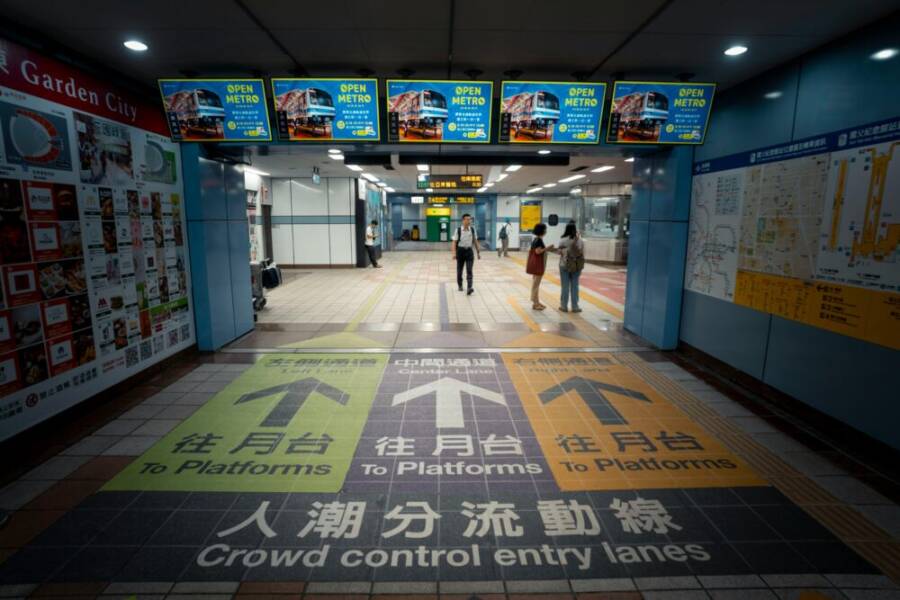 Direction arrows at a busy metro station