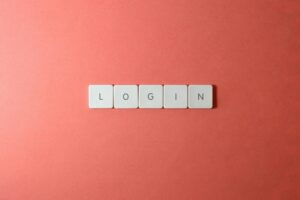 Close-up of login keyboard tiles on a coral background, perfect for tech themes.