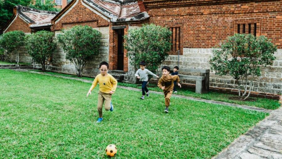 A joyful group of children playing near the water at a family-friendly outdoor spot
