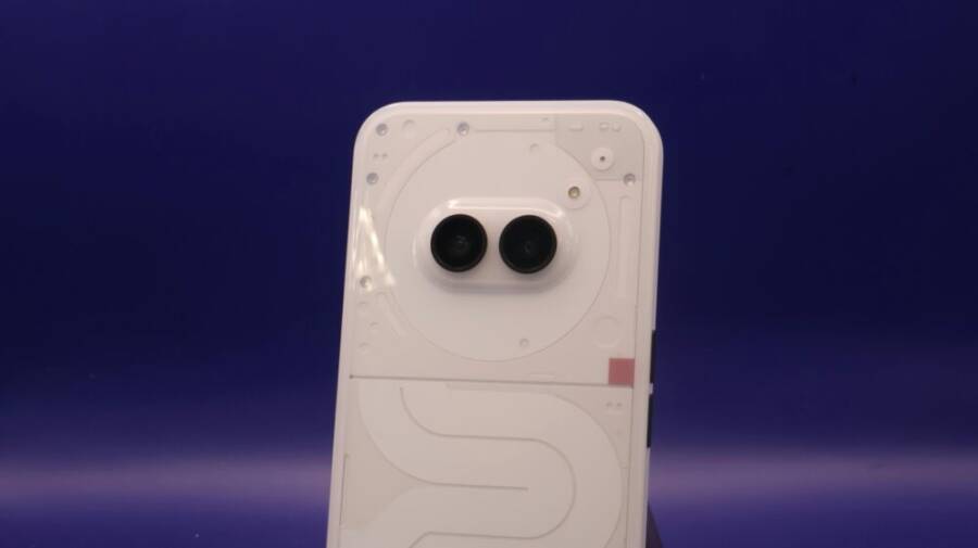 A sleek smartphone with dual cameras against a vibrant blue background.