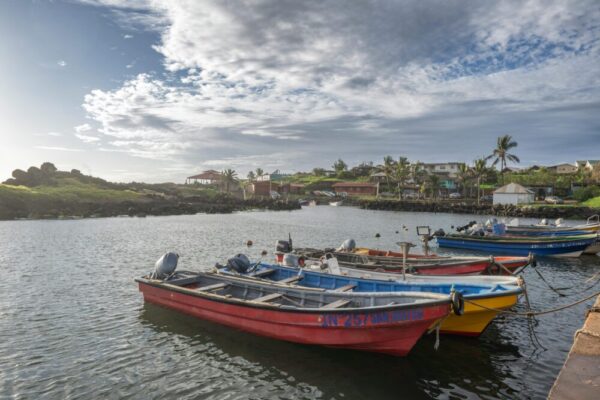 Vibrant fishing boats moored at a scenic harbor in Valparaíso, Chile