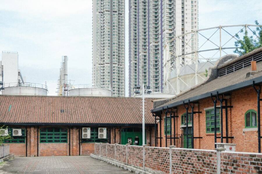 Old industrial buildings meet new skyscrapers in this Hong Kong urban scene.