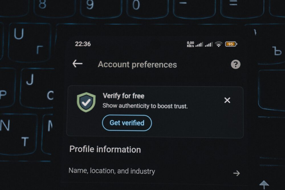 Close-up of a smartphone screen displaying account verification alert