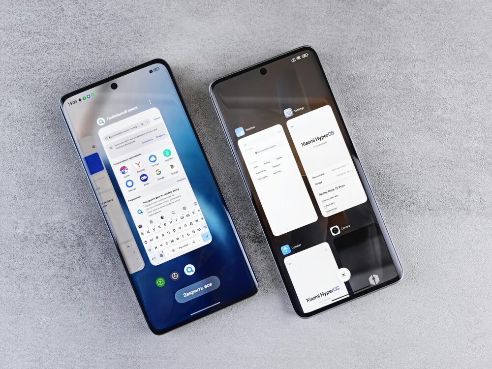 Top view of two modern smartphones with different interfaces on display