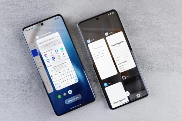 Top view of two modern smartphones with different interfaces on display