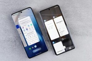 Top view of two modern smartphones with different interfaces on display.