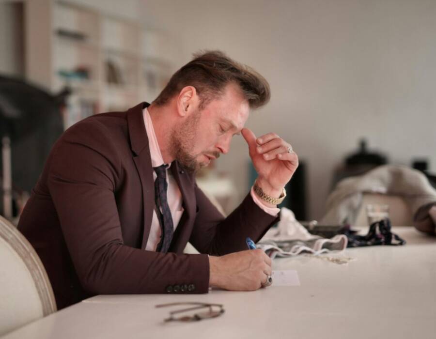 image of a thoughtful entrepreneur planning at a desk