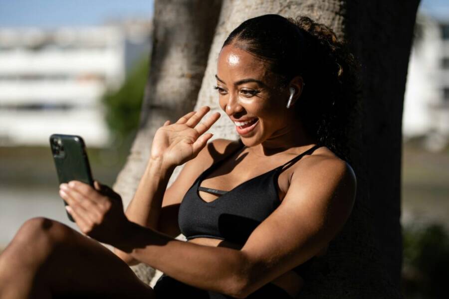 image of a person using a smartphone with both buttons and gestures in view