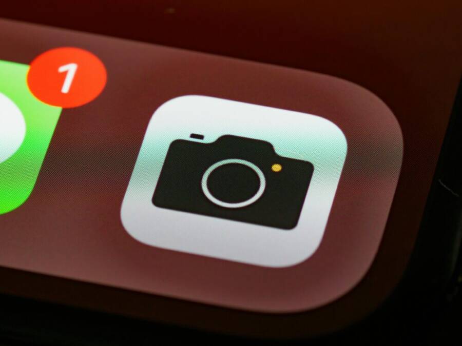 Detailed view of a smartphone camera app icon with notification badge