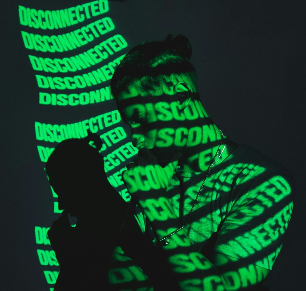 A man stands in shadow with