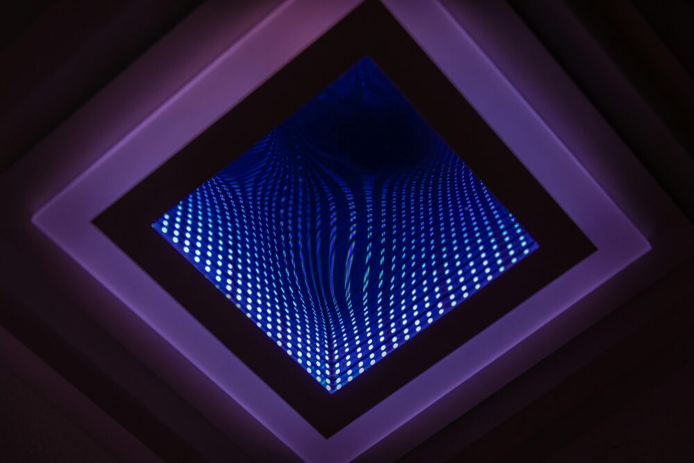 A captivating abstract view of a LED infinity mirror with vibrant light patterns