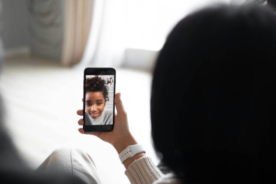 image of a family video call on a smartphone