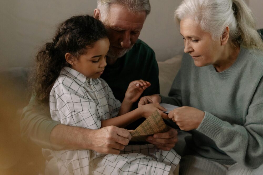 image of a family reviewing photos together at home