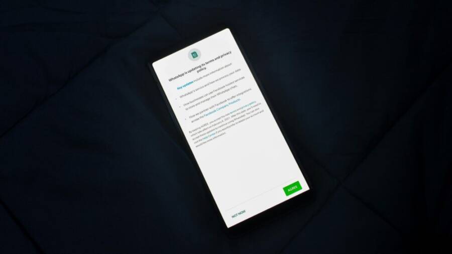 Close-up of a smartphone screen showing a privacy policy update agreement